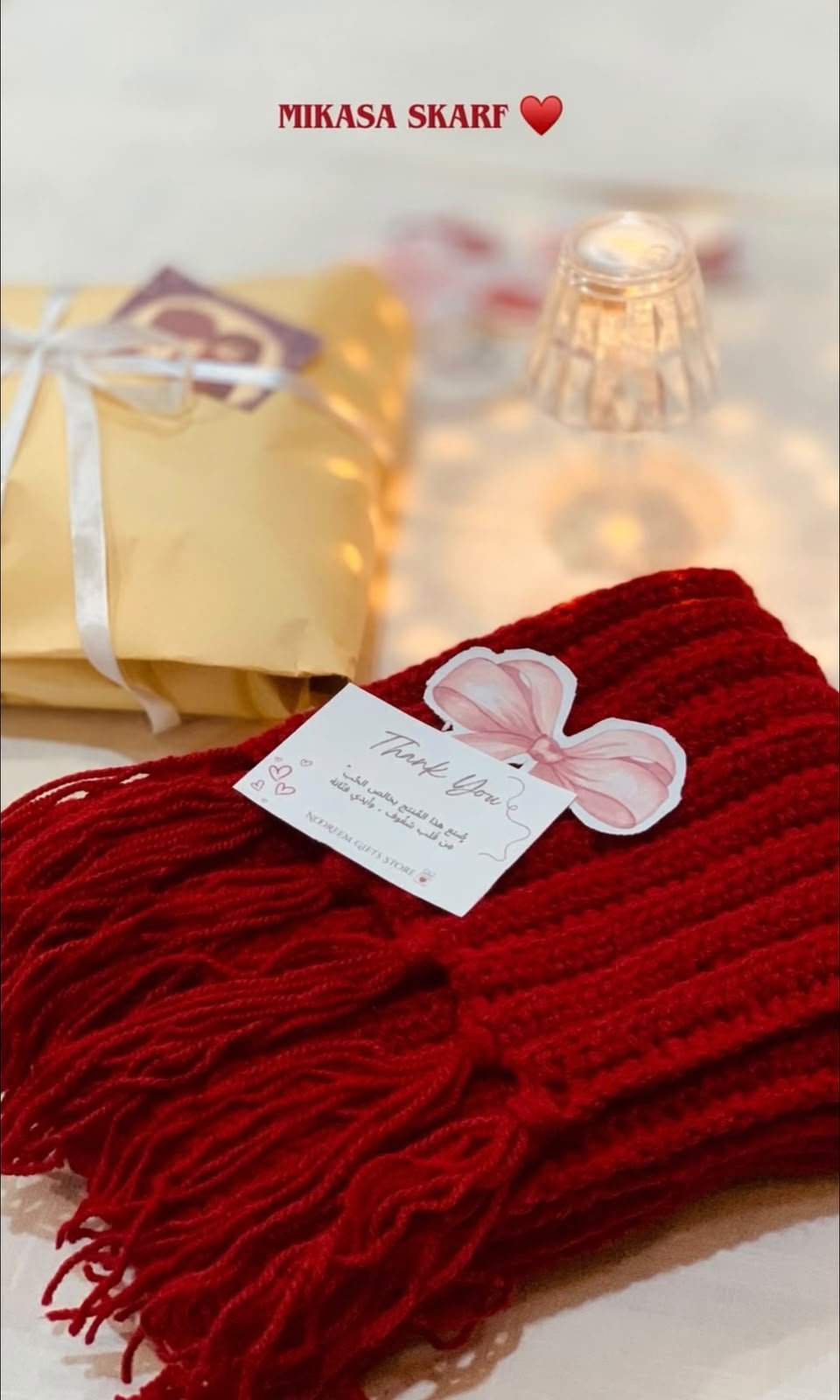 Red knitted scarf gift with thank you card